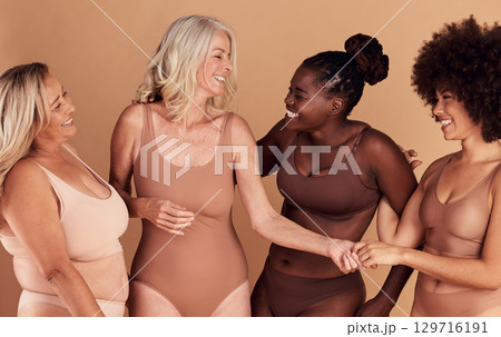 Diversity, women and skincare for body positivity, cosmetics or conversation on brown studio background. Health females and multiracial ladies with confidence, wellness or talking with smile or laugh 129716191