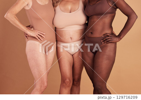Diversity, closeup or women with body positivity, wellness or support on brown studio background. Multiracial, females or ladies with solidarity, skincare or confident for natural beauty or community 129716209