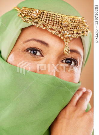Eyes, hijab and Muslim, woman with Islamic fashion and face zoom with veil and jewelry, beauty and microblading portrait. Cosmetic lens, religion freedom and wellness with fashion model and vision. 129716283