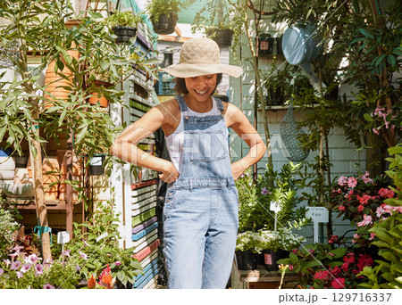 Gardening, plants and black woman happy working in flowers retail supermarket, nature agriculture and standing in small business shop. Gardener, smile and proud girl in greenhouse for herbs ecology 129716337