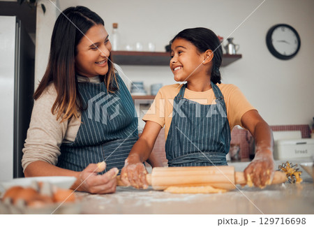 Family, mother and girl learning baking in kitchen, bonding and having fun. Food, cooking education and mom teaching chef kid how to bake delicious pastry, smiling and enjoying quality time together. Family, mother and girl learning baking in kitchen, bonding and having fun. Food, cooking education and mom teaching chef kid how to bake delicious pastry, smiling and enjoying quality time together. 129716698