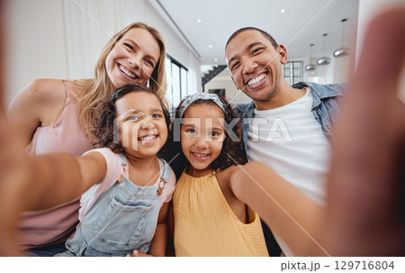 Family selfie, bonding and children with parents, cheerful and playful smile on the living room sofa. Quality time, happy photo and girl kids with interracial mother and father for a home memory Family selfie, bonding and children with parents, cheerful and playful smile on the living room sofa. Quality time, happy photo and girl kids with interracial mother and father for a home memory 129716804