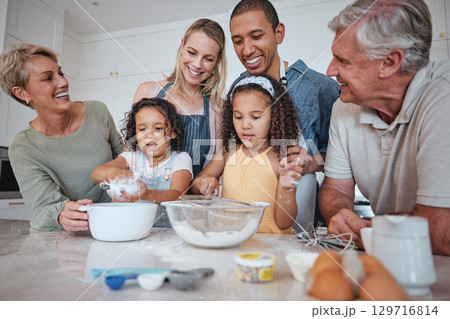Baking, family and children with their parents and grandparents in the kitchen learning about cooking food. Bake, bonding and love with girl siblings making baked goods in their home together 129716814