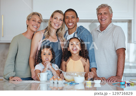 Interracial, portrait or big family in a kitchen cooking food or baking cake with eggs, flour or milk at home. Bakers, mother and happy father love bonding with children or grandparents on holiday Interracial, portrait or big family in a kitchen cooking food or baking cake with eggs, flour or milk at home. Bakers, mother and happy father love bonding with children or grandparents on holiday 129716829