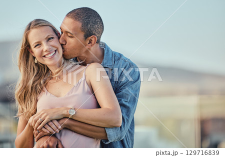 Couple, hug and kiss for love, care or compassion in happy relationship, bonding or free time on mockup. Woman smiling with man kissing cheek and hugging in romantic quality bonding together outside 129716839