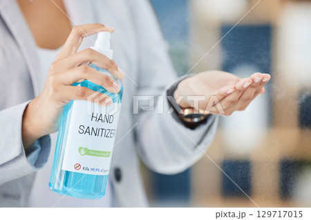 Hand sanitizer, hand and business woman, covid and health, hygiene and cleaning hands at office, disinfect and safety from virus. Covid 19 compliance, disinfection at work with worker and healthcare. 129717015