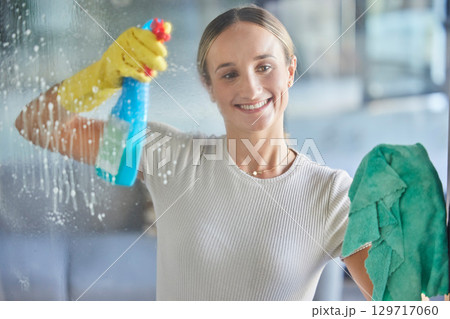 Woman, spring cleaning spray and bottle for windows in house with cloth for dust, bacteria and dirt in room, apartment and home. Happy housekeeping, glass cleaner and maid with chemical detergent 129717060