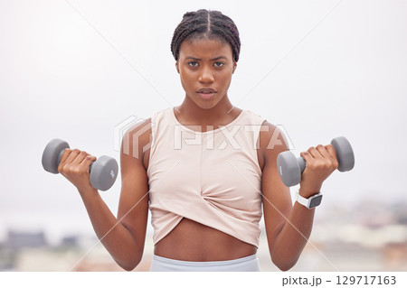 Portrait, black woman and dumbbells for training, exercise or workout for wellness, health or power. Young female, Jamaican girl or athlete with gym equipment, practice or fitness for energy or focus Portrait, black woman and dumbbells for training, exercise or workout for wellness, health or power. Young female, Jamaican girl or athlete with gym equipment, practice or fitness for energy or focus 129717163