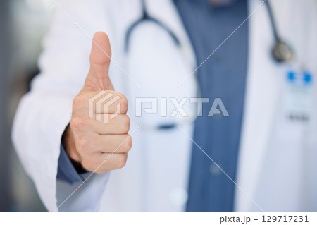 Winner, success and doctor thumbs up at hospital for agreement, achievement or thank you. Healthcare, cardiology and professional medical man approval, ok or vote in medicare career. 129717231