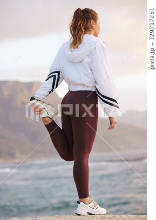 Runner woman, stretching legs and beach for health, fitness and ready for training, exercise and run. Warm up, ocean running or muscle development in workout, wellness and focus for girl in Vancouver Runner woman, stretching legs and beach for health, fitness and ready for training, exercise and run. Warm up, ocean running or muscle development in workout, wellness and focus for girl in Vancouver 129717251