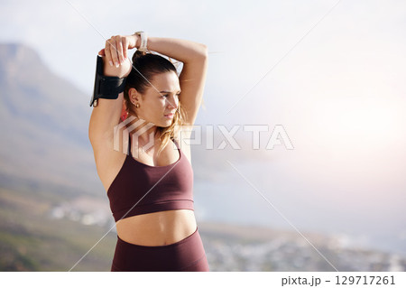 Fitness stretching, woman and exercise training outdoor in the South Africa mountains for workout. Muscle stretch, morning runner and health commitment of a run athlete with sports watch in nature 129717261