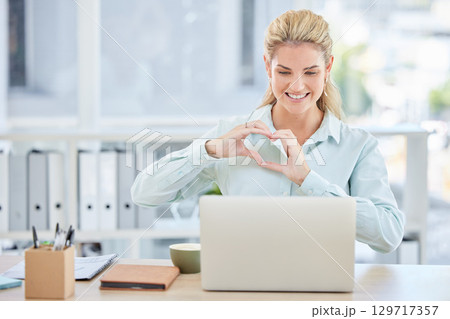 Woman, laptop and heart shape hands in office or happy video call for digital marketing or networking collaboration online. Video conference, manager hands and happy for love or corporate support Woman, laptop and heart shape hands in office or happy video call for digital marketing or networking collaboration online. Video conference, manager hands and happy for love or corporate support 129717357