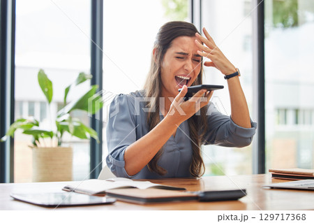 Business woman, stress and phone call in office by angry employee shouting, frustrated or annoyed by phishing. Manager, anxiety and headache while talking on phone, pressure and burnout from deadline 129717368