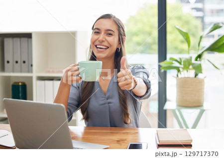 Portrait, thumbs up or business woman with coffee, office or achievement for startup company or marketing strategy. Young female, ceo or entrepreneur with tea, hand gesture for application or success 129717370