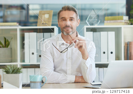 Portrait, businessman or ceo in leadership thinking of a creative advertising or marketing strategy in office building. Face, vision or thoughtful boss with glasses with growth mindset or solutions Portrait, businessman or ceo in leadership thinking of a creative advertising or marketing strategy in office building. Face, vision or thoughtful boss with glasses with growth mindset or solutions 129717418