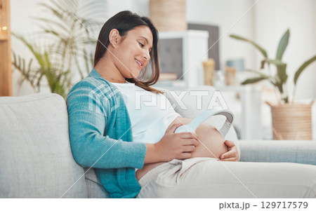 Pregnant, woman and stomach with headphones for music for her unborn baby while relaxing at home. Belly, baby bump and pregnancy with a mother using a headset for audio or podcast streaming Pregnant, woman and stomach with headphones for music for her unborn baby while relaxing at home. Belly, baby bump and pregnancy with a mother using a headset for audio or podcast streaming 129717579