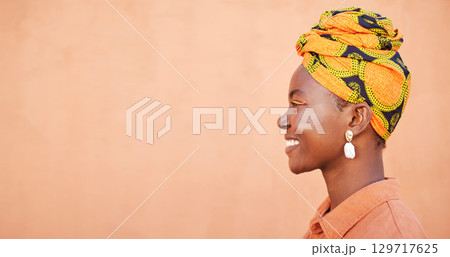 Cosmetics, black woman and smile with head wrap, natural beauty and color on studio background. Jamaican female, profile and lady with traditional headscarf for culture, stylish makeup with mockup. Cosmetics, black woman and smile with head wrap, natural beauty and color on studio background. Jamaican female, profile and lady with traditional headscarf for culture, stylish makeup with mockup. 129717625