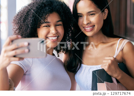 Friends, phone and selfie while shopping with a smile, happiness and love for social media profile picture with influencer or content creator. Black female customers with smartphone for blog post 129717674