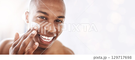 Black man, skincare portrait and cream by mockup space, smile or happy for cosmetic beauty by blurred background. African gen z model, skin health and natural glow with product placement mock up Black man, skincare portrait and cream by mockup space, smile or happy for cosmetic beauty by blurred background. African gen z model, skin health and natural glow with product placement mock up 129717698