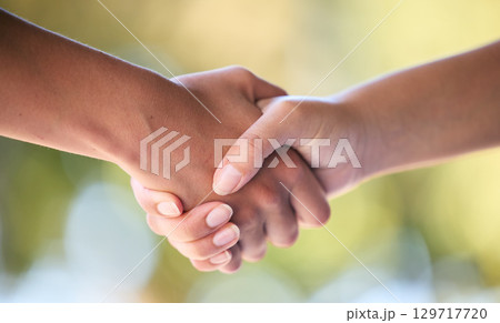 Handshake, support and hands for support in sports, fitness and exercise in outdoor park. Teamwork, collaboration and women shaking hands for friendship, thank you and community in sport training Handshake, support and hands for support in sports, fitness and exercise in outdoor park. Teamwork, collaboration and women shaking hands for friendship, thank you and community in sport training 129717720