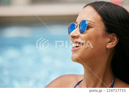 Woman, face sunglasses and laughing by pool on summer break, holiday vacation or tropical travel fun. Mockup, happy smile or tourist student with fashion accessory by hotel or luxury resort water Woman, face sunglasses and laughing by pool on summer break, holiday vacation or tropical travel fun. Mockup, happy smile or tourist student with fashion accessory by hotel or luxury resort water 129717733
