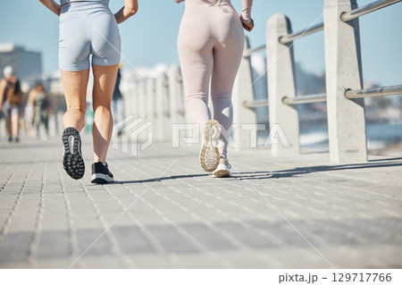 Beach, running and couple of friends legs for sports training, fitness and exercise together in summer wellness, support and accountability. Runner, athlete and marathon people feet in workout by sea 129717766