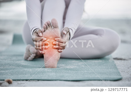 Woman, foot pain and injury at beach after yoga practice, stretching or workout for health and wellness. Sports, pilates or female massage feet, fibromyalgia or muscle tension after exercise outdoors Woman, foot pain and injury at beach after yoga practice, stretching or workout for health and wellness. Sports, pilates or female massage feet, fibromyalgia or muscle tension after exercise outdoors 129717771