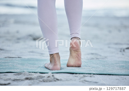 Woman, bare feet and beach yoga exercise, workout and stretching ankle on sand for zen energy, healthy lifestyle or body wellness. Closeup, foot and fitness at ocean for pilates, balance and training Woman, bare feet and beach yoga exercise, workout and stretching ankle on sand for zen energy, healthy lifestyle or body wellness. Closeup, foot and fitness at ocean for pilates, balance and training 129717887