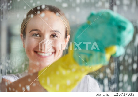Cleaning, washing and portrait of woman by window with foam, cleaning products and cloth for housework. Spring cleaning, housekeeping and happy girl wipe dirt and dust on glass window for clean home Cleaning, washing and portrait of woman by window with foam, cleaning products and cloth for housework. Spring cleaning, housekeeping and happy girl wipe dirt and dust on glass window for clean home 129717935
