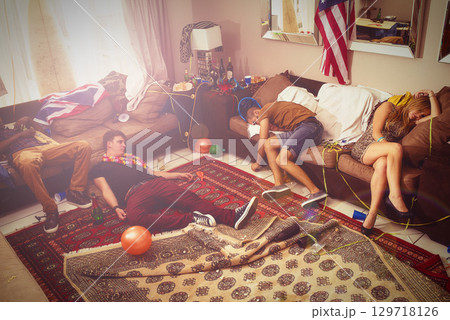 Sleeping, drunk and party with people in living room in the morning with hangover, celebration and spring break. Summer, social and drink with group of friends at home for event, tired and vacation 129718126