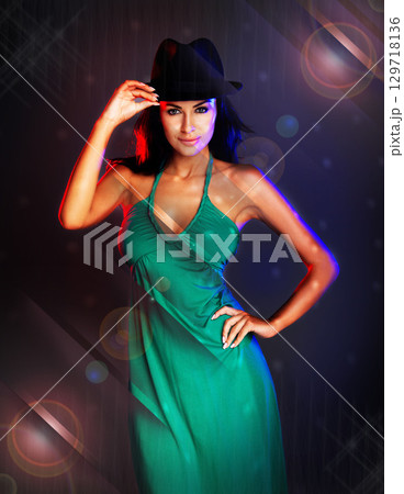 Woman, disco portrait and fashion dress by dark studio background for party, club or dancing in night. Smile, happy rock model or smile in nightclub, social or new year for event, lens flare or shine 129718136