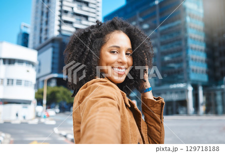 Selfie, urban city and black woman for travel, fashion influencer or portrait update of her journey in street. Walking, USA New York and happy face of young person in road with natural hair or afro Selfie, urban city and black woman for travel, fashion influencer or portrait update of her journey in street. Walking, USA New York and happy face of young person in road with natural hair or afro 129718188
