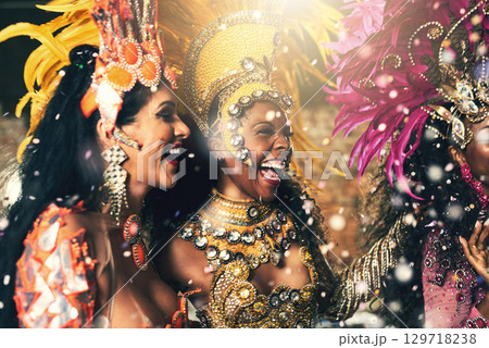 Women, samba and dancers hugging and bonding in costume before a carnival celebration. Party, festival and group of ladies in creative outfits in Rio de Janeiro for artist or artistic performance 129718238