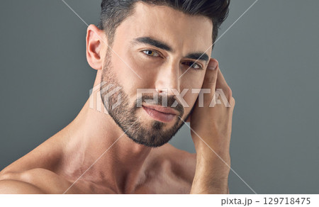 Man, face and skincare on gray studio background in healthcare wellness, Brazilian beard or collagen dermatology. Portrait, model headshot and facial hair growth on grey backdrop or grooming routine Man, face and skincare on gray studio background in healthcare wellness, Brazilian beard or collagen dermatology. Portrait, model headshot and facial hair growth on grey backdrop or grooming routine 129718475
