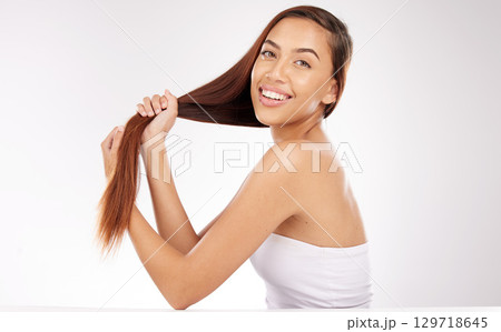 Face portrait, beauty and hair care of woman in studio isolated on a white background mockup. Balayage, hairstyle and female model from Brazil holding long hair after salon hair treatment for growth. 129718645