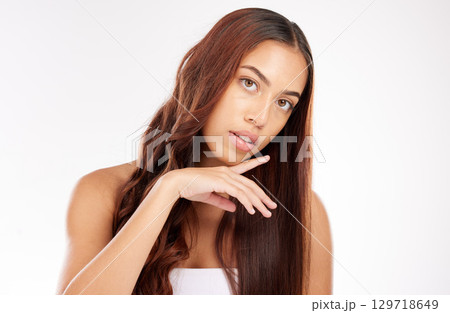 Woman, beauty and portrait in studio for hair care, shine and wavy texture, makeup and skincare in Colombia on white background. Young model, hair style and aesthetic cosmetics, salon and wellness Woman, beauty and portrait in studio for hair care, shine and wavy texture, makeup and skincare in Colombia on white background. Young model, hair style and aesthetic cosmetics, salon and wellness 129718649