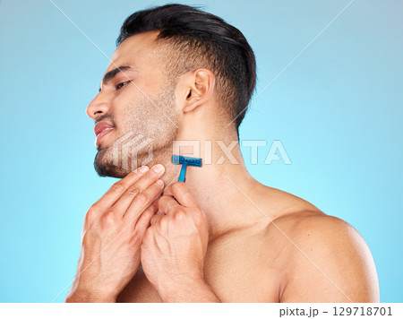 Man, shaving beard and facial skincare cleaning for beauty wellness, morning grooming or self care in studio. Face cleaning, cosmetics dermatology care and shave with razor for self care hygiene 129718701