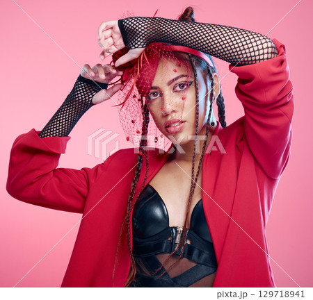 Punk, fashion and woman with makeup on face for metal, rock and edgy style against a pink studio background. Expression, funky and portrait of latino model or person in a 90s clothes and mockup space Punk, fashion and woman with makeup on face for metal, rock and edgy style against a pink studio background. Expression, funky and portrait of latino model or person in a 90s clothes and mockup space 129718941
