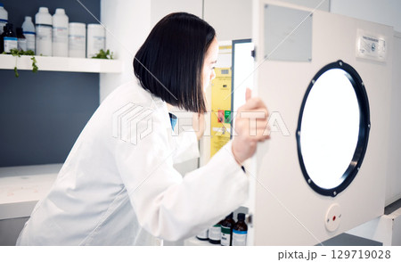 Science, woman and scientist in laboratory with incubator, check for experiment, research and scientific innovation. Professional, phd doctor and chemistry, physics or biotechnology study in lab. Science, woman and scientist in laboratory with incubator, check for experiment, research and scientific innovation. Professional, phd doctor and chemistry, physics or biotechnology study in lab. 129719028