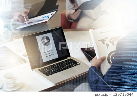 Business people, laptop and analytics working at the office in research or data statistics in double exposure. Employee team in corporate strategy, competitor analysis or marketing in digital overlay Business people, laptop and analytics working at the office in research or data statistics in double exposure. Employee team in corporate strategy, competitor analysis or marketing in digital overlay 129719044