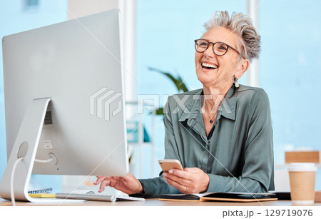 Happy senior, executive woman and computer at office desk, smile and reading on social media, email or meme. Elderly manager, receptionist or communication expert with happiness, comic or funny laugh 129719076