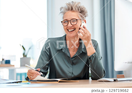 Business woman, phone call and conversation for connection, smile and in office. Senior, female entrepreneur and lady with smartphone, talking and chatting with notebook, pc and in workplace. 129719082