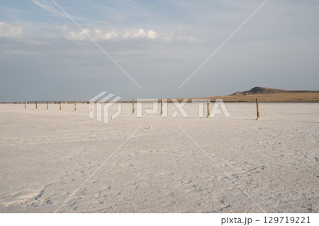 Landscape of the salt lake Baskunchak. View of Mount Big Bogdo. Astrakhan region, Russia Landscape of the salt lake Baskunchak. View of Mount Big Bogdo. Astrakhan region, Russia 129719221
