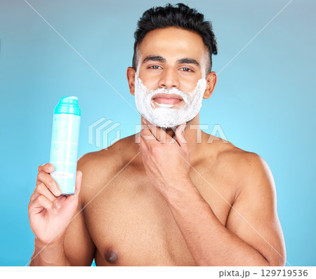 Face, skincare and man with shaving cream product in studio isolated on a blue background. Beauty, hair care and male model from Brazil with shave gel for beard grooming, cleaning and facial hygiene. Face, skincare and man with shaving cream product in studio isolated on a blue background. Beauty, hair care and male model from Brazil with shave gel for beard grooming, cleaning and facial hygiene. 129719536