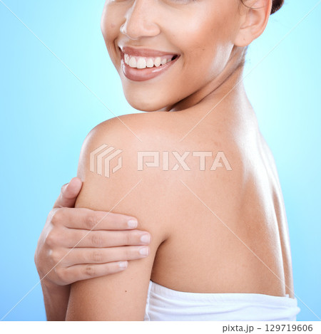 Beauty, wellness and healthy skincare woman with happy smile, luxury product or blue studio background with mockup. Skin care, happiness and advertising cosmetics product with female model with pride 129719606