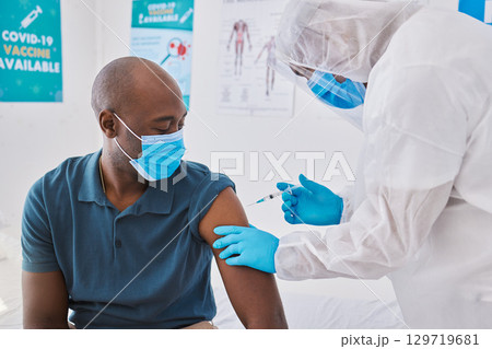 Covid vaccine, injection and disease cure given with needle and syringe by a doctor in a clinic. Patient getting a flu jab, antiviral shot and health treatment to boost immunity and prevent illness Covid vaccine, injection and disease cure given with needle and syringe by a doctor in a clinic. Patient getting a flu jab, antiviral shot and health treatment to boost immunity and prevent illness 129719681
