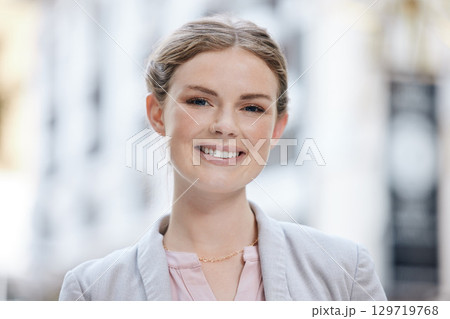 Portrait of a smile of a happy woman entrepreneur outside with vision for a success in business and her startup company. Corporate worker, startup or manager face looking cheerful with motivated Portrait of a smile of a happy woman entrepreneur outside with vision for a success in business and her startup company. Corporate worker, startup or manager face looking cheerful with motivated 129719768