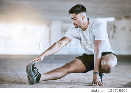 Runner stretching legs for exercise, workout and fitness training for sport performance in an urban city. Motivation, active and running wellness athlete ready for sports run, marathon or health jog Runner stretching legs for exercise, workout and fitness training for sport performance in an urban city. Motivation, active and running wellness athlete ready for sports run, marathon or health jog 129719802