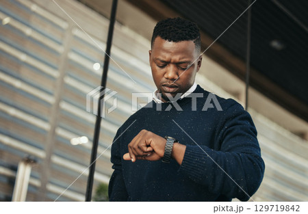 Time, watch at an airport for travel with a businessman looking at his wristwatch. Entrepreneur check the hour for a flight, an appointment or an airplane schedule in the morning to get transport Time, watch at an airport for travel with a businessman looking at his wristwatch. Entrepreneur check the hour for a flight, an appointment or an airplane schedule in the morning to get transport 129719842