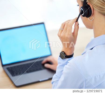 Call center, contact us and laptop of a woman employee or agent using her computer with headset in the office. Female worker in customer support or telemarketing at her desk ready for consulting. Call center, contact us and laptop of a woman employee or agent using her computer with headset in the office. Female worker in customer support or telemarketing at her desk ready for consulting. 129719871